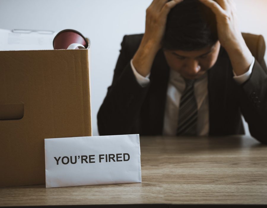 Male employee is stressed or angry while he is fired from being an employee of the company.